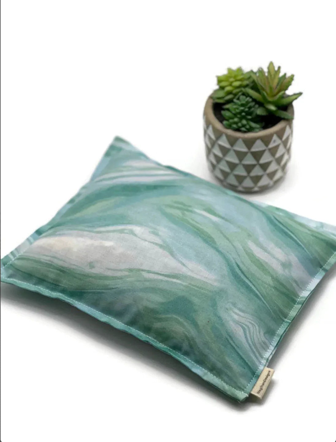 green marble fabric on a white table