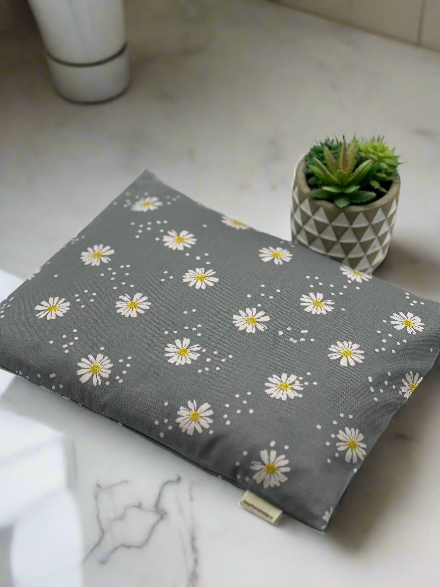 Gray cotton fabric with daisies printed on