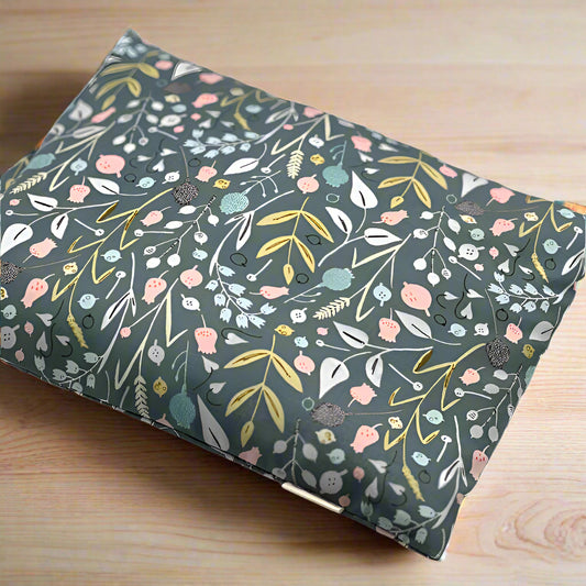 green fabric with different flowers and leaves designs printed heating pad