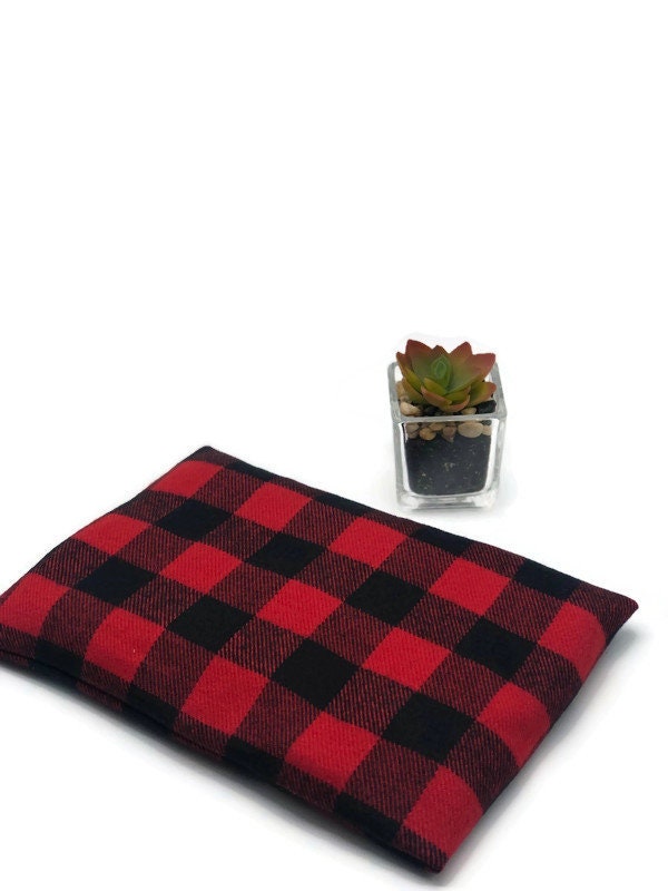 Black an d red checkers heating pad on a white background