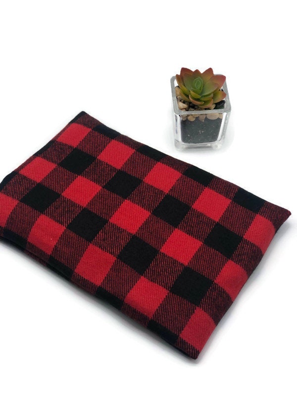 black and red checkers fabric corn heating cooling pad on a white background