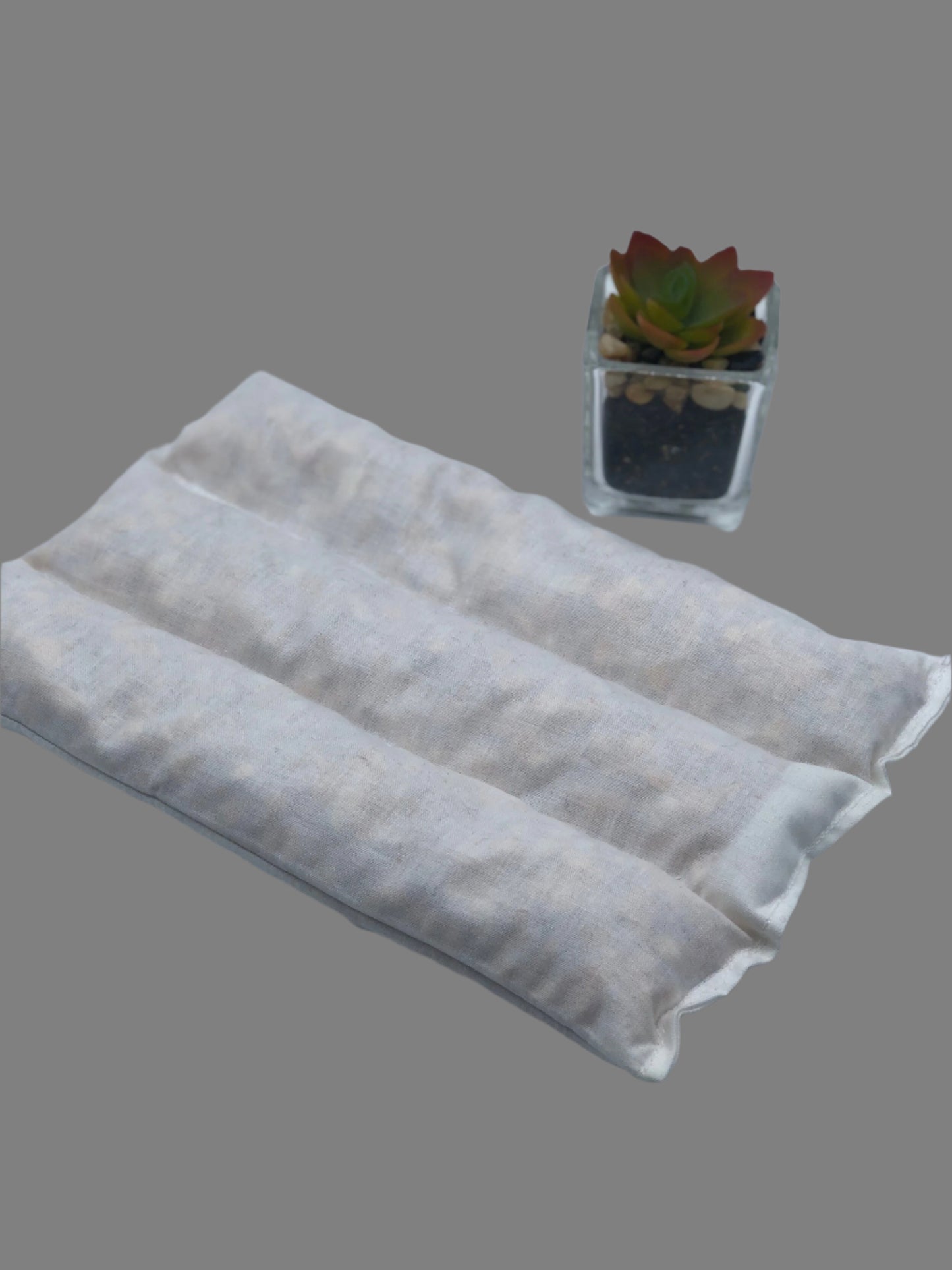 Three sectional heating and cooling pad insert on a gray background