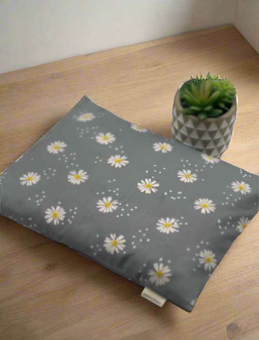 Gray cotton fabric with daisies printed on it